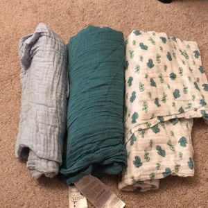 Three muslin swaddles